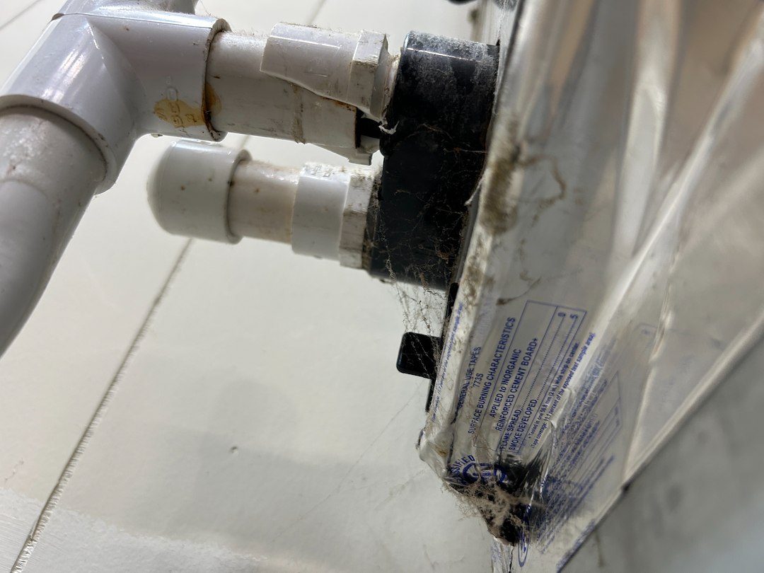Broken Drain Line on a Heat Pump Flooding a Laundry Room in Johnson City, TN